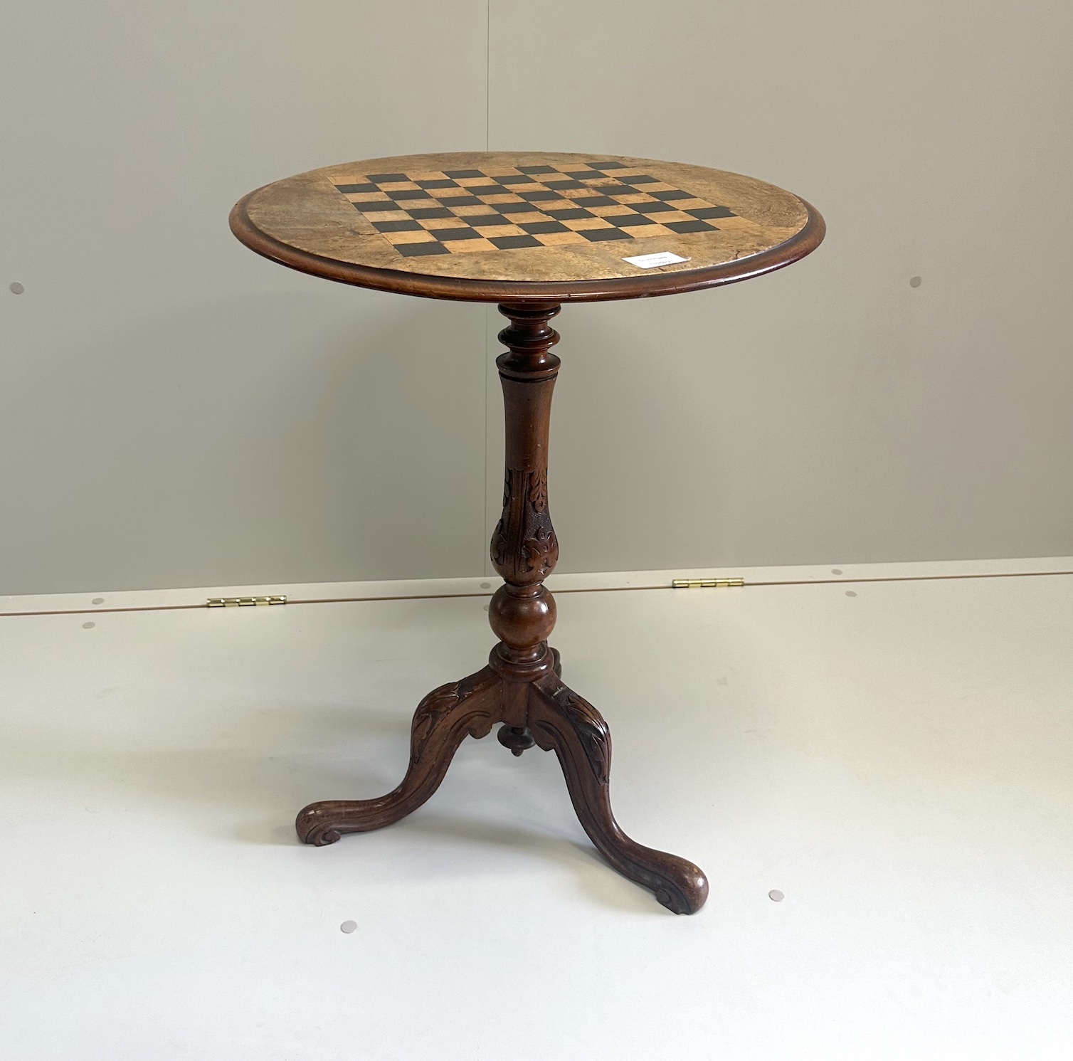A Victorian circular walnut parquetry inlaid tripod games table, diameter 50cm, height 66cm